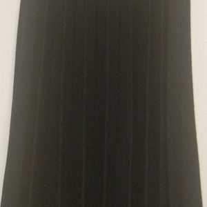 Pleated black skirt with gold trim